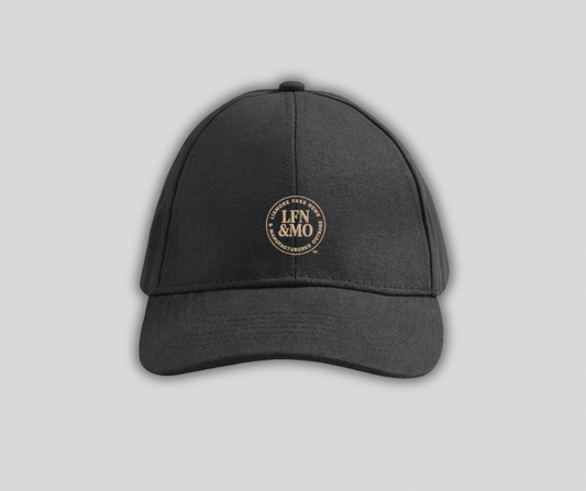 Black cap with a logo on a gray background