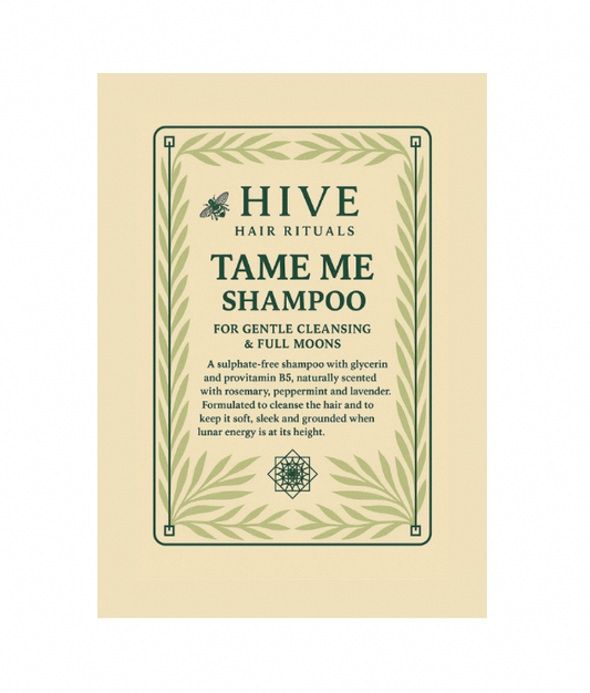 Hive Tame Me Shampoo packaging on a beige background