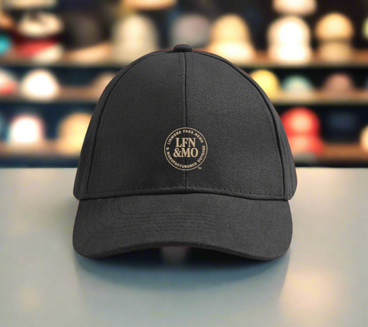 Black cap with a logo on a blurred background of shelves with hats