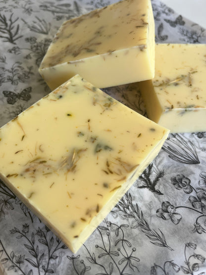Three natural handmade soap bars with added herbs
