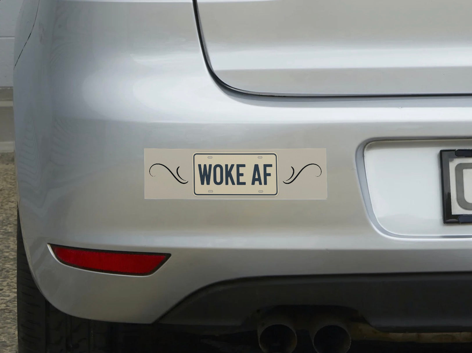 Car with a 'Woke AF' bumper sticker on the rear