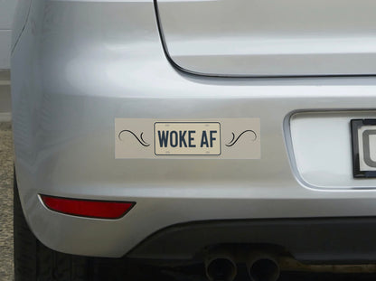 Car with a 'Woke AF' bumper sticker on the rear