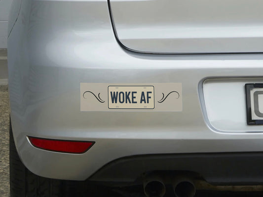 Car with a 'Woke AF' bumper sticker on the rear