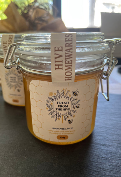 Jar labeled 'Hive' with a yellow label on a gray surface