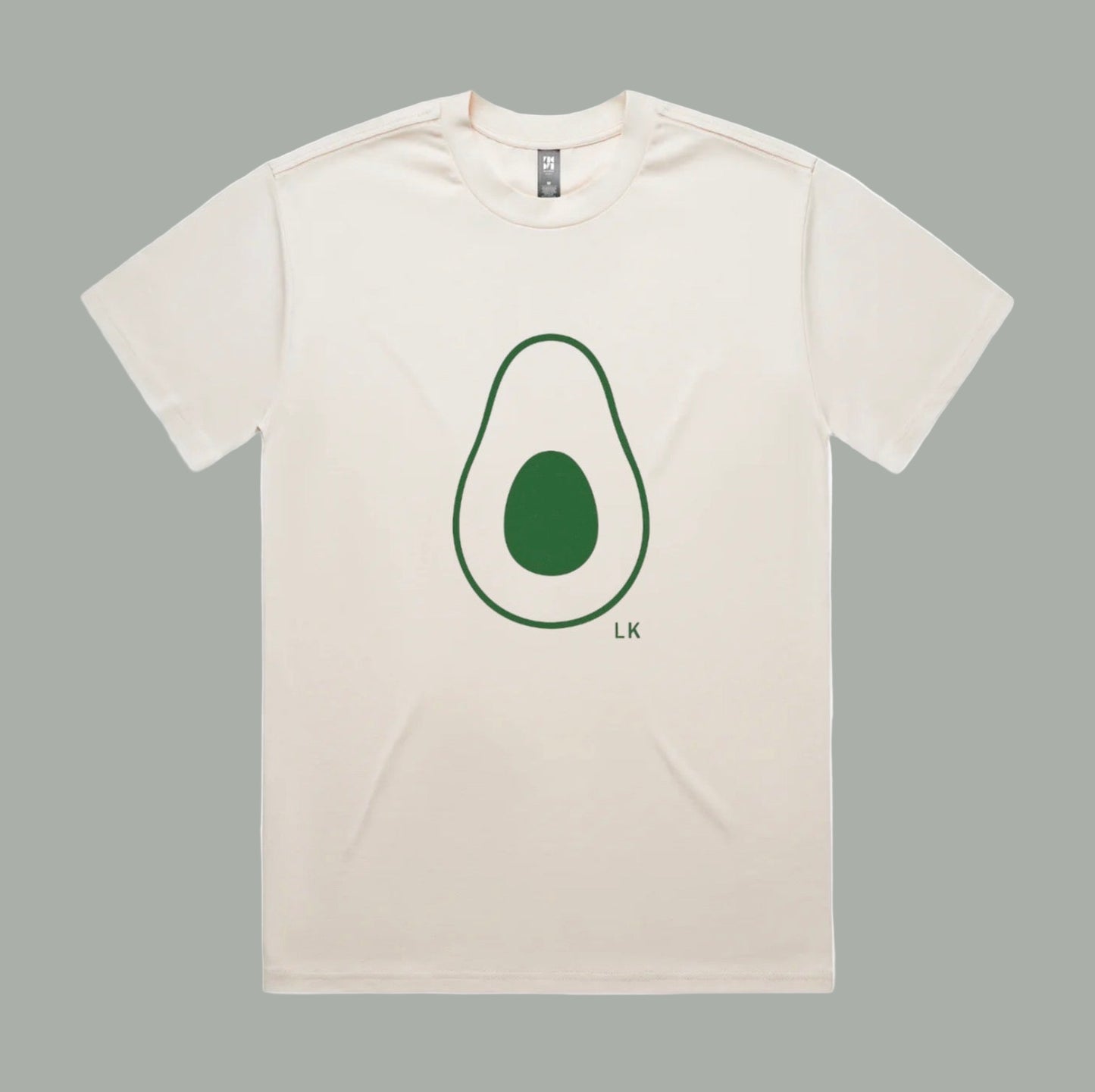 Beige t-shirt with an avocado graphic and 'LK' branding on a white background