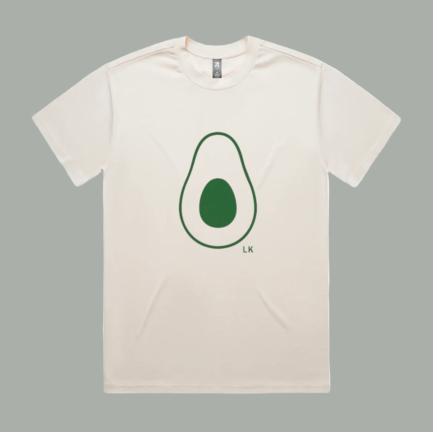 Beige t-shirt with an avocado graphic and 'LK' branding on a white background