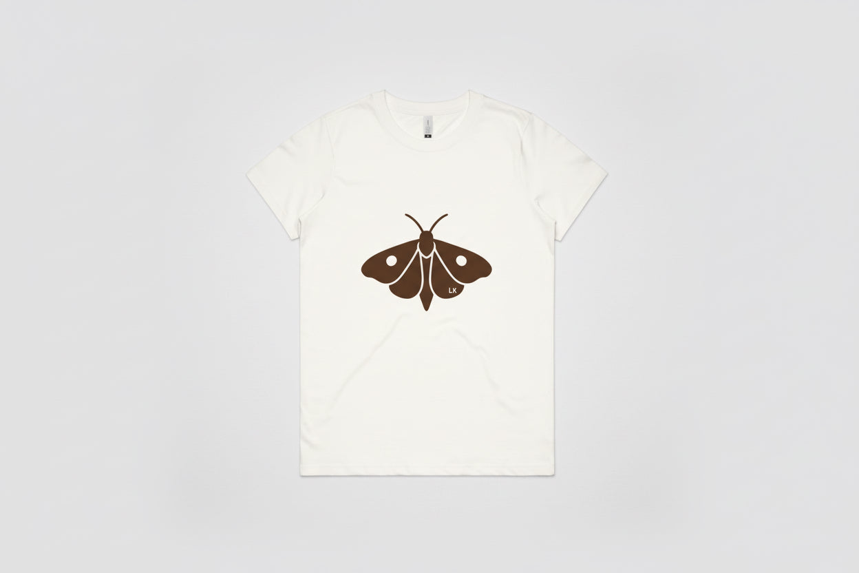 White t-shirt with a brown moth graphic on a white background
